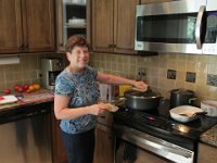 2014071057 Betty Hagberg cooking in her kitchen - Moline IL