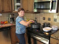 2014071058 Betty Hagberg cooking in her kitchen - Moline IL