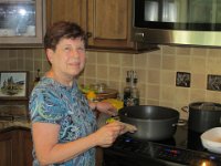 2014071059 Betty Hagberg cooking in her kitchen - Moline IL