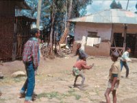 1966011134 Children playing ball in neighbors yard