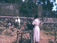 1966041120  Woman filling water jug-Addis