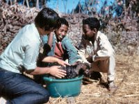 1964111113 Barb & students giving our dog a bath