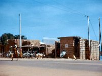 1965081111 Old City of Kano Nigeria - Woman carring pot on head